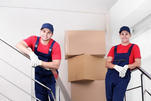 Storage staff sorting recyclable cardboard and packaging at Brondesbury Storage