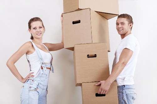 Moving office furniture through a Brondesbury building with tight access