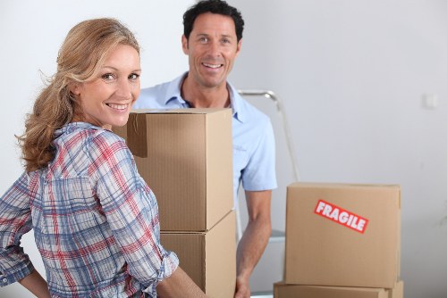 Organized storage unit in Brondesbury with labeled boxes and furniture