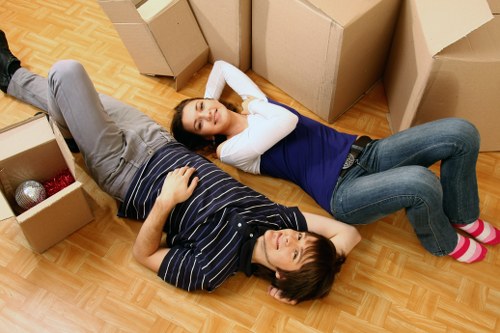 Packed moving boxes ready for flat removals in Brondesbury