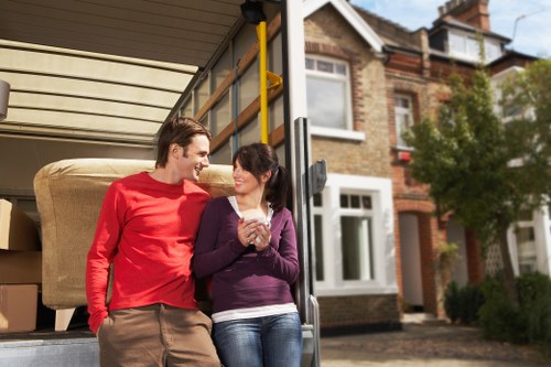 Packed storage boxes and household items in a Brondesbury self storage space